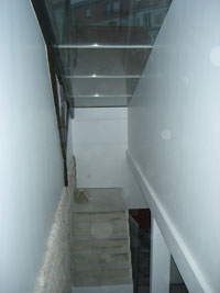 Puit de lumière sur l'escalier